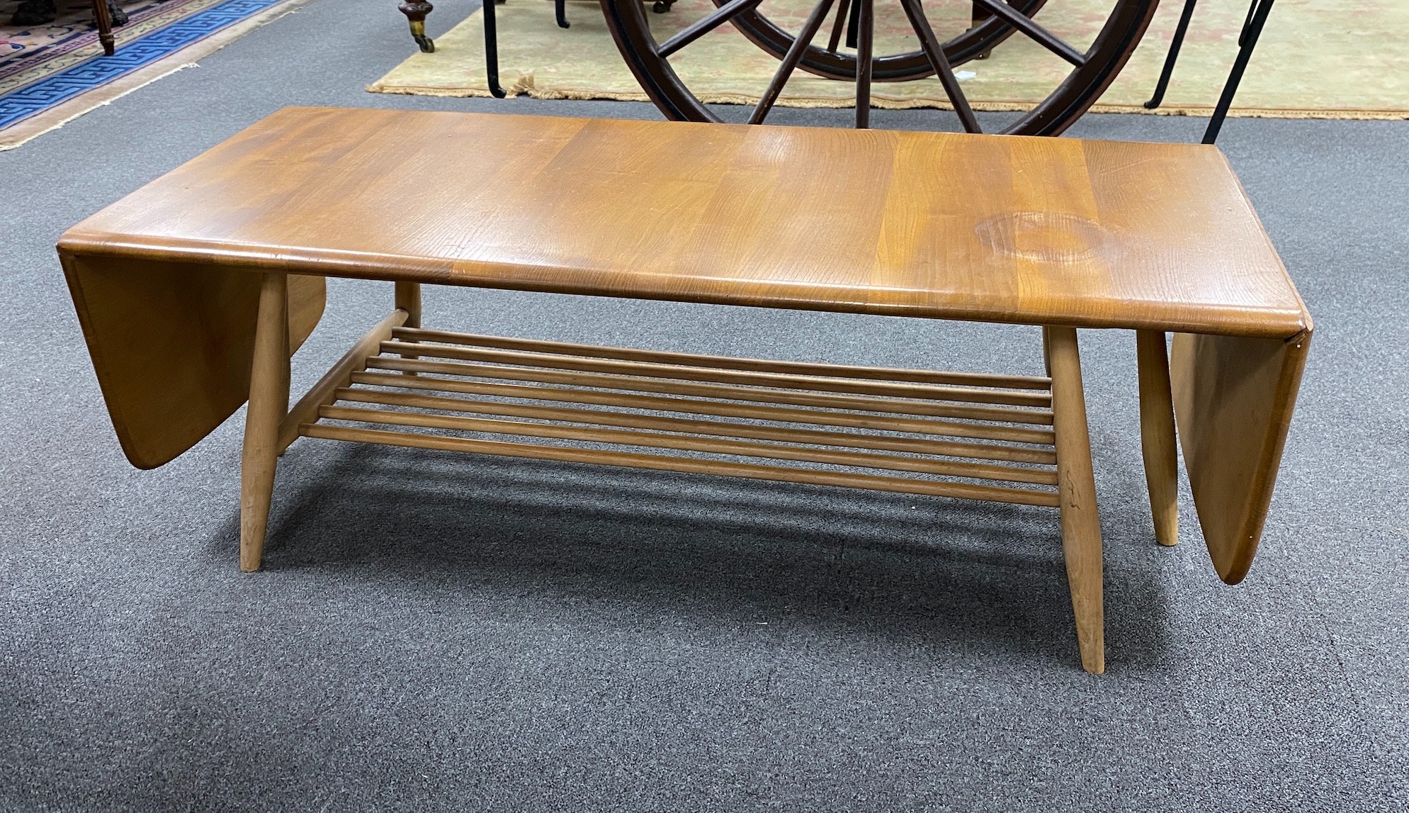 An Ercol elm drop flap coffee table, length 106cm, depth 45cm, height 36cm
